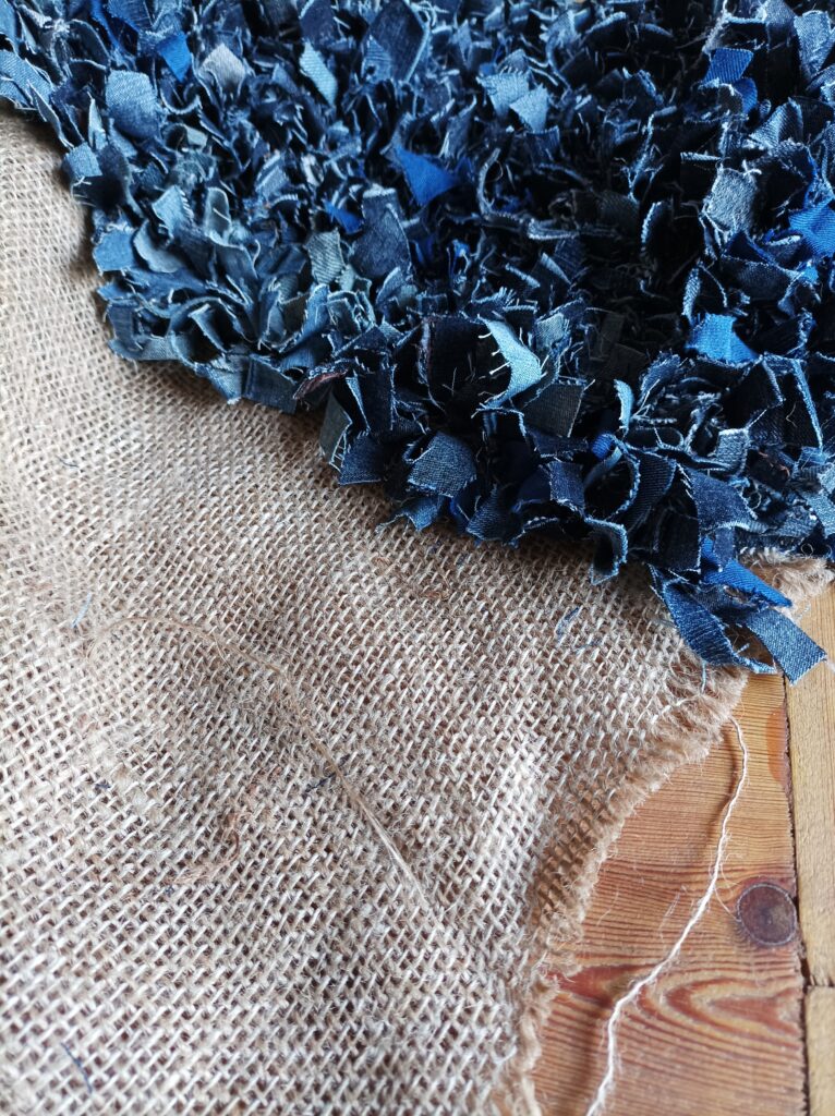 Close up of a denim rag rug made with old jeans
